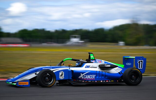 Thomas Nordquist and the XCancer race car at the Portland International Raceway on Aug. 7, 2025.