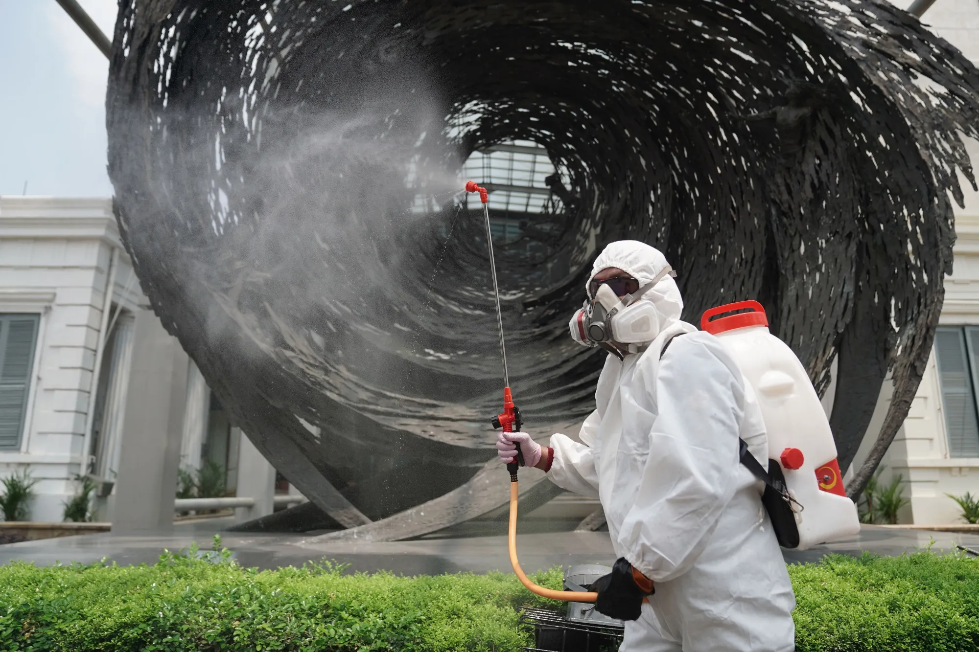 A member of the Indonesian Red Cross Society sprays disinfectant&nbsp;in Jakarta, on&nbsp;Sept. 5.