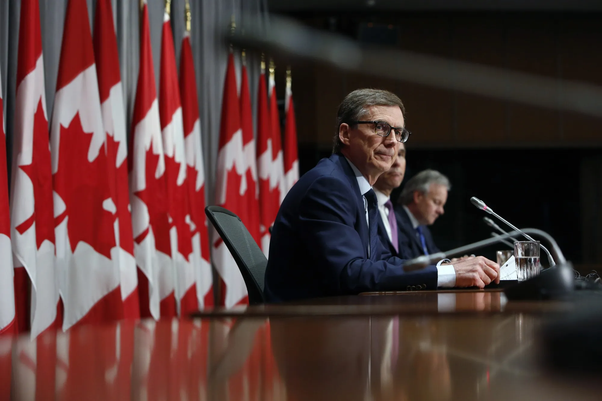 Tiff Macklem listens during an Ottawa news conference announcing his appointment as governor of the Bank of Canada on May 1.