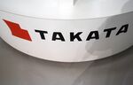 The Takata logo is displayed at a showroom in Tokyo.
