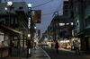 Pedestrians walk on the Sugamo Jizo-dori shopping street in the Toshima district of Tokyo, Japan, on Friday, Dec. 11, 2020. Japanese Prime Minister Yoshihide Suga has briefly put virus containment ahead of the economy by temporarily halting a nationwide travel campaign aimed at spurring spending among consumers including the elderly.