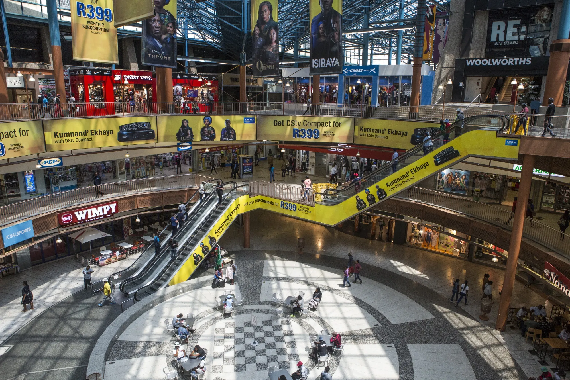Visitors shop in the main plaza at a mall in the Central Business District of Johannesburg.