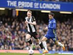 Newcastle's Sean Longstaff, left, and Chelsea's Mason Mount vie for the ball during the English Premier League soccer match between Chelsea and Newcastle United at Stamford Bridge stadium in London, Sunday, March 13, 2022. (AP Photo/Kirsty Wigglesworth)