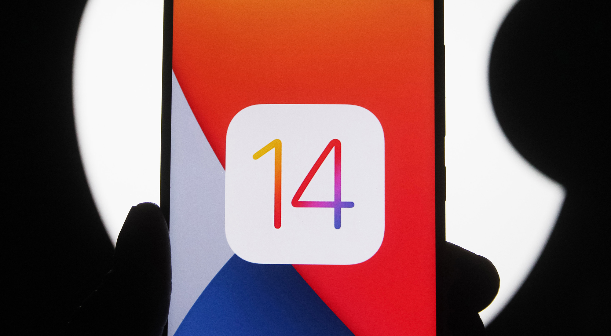 In this photo illustration the iOS 14 logo of the iOS mobile