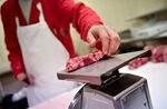 Butcher Justin Taylor weighs a beef ribeye steak at the Wyanet Locker in Wyanet, Illinois.