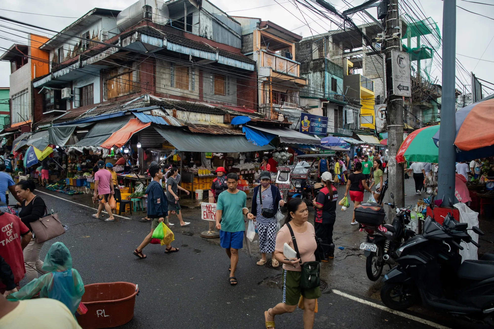 Shoppers at a street market in Taguig City, the Philippines, in 2024.