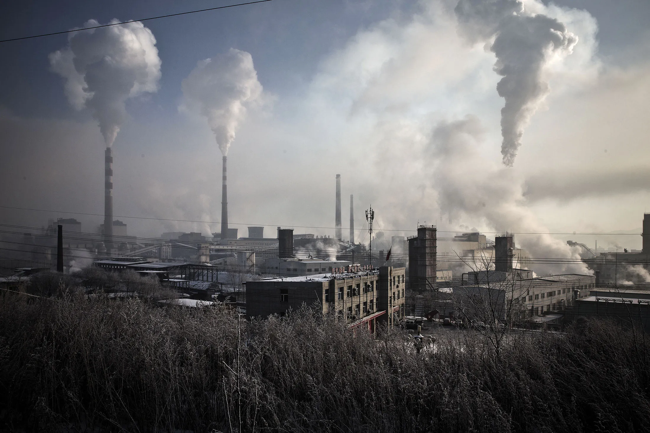 Water vapor and smoke rise from a steel plant in the Erdaojiang district in Tonghua, Jilin province, China.
