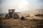 A tractor cuts down corn in a field designated as zero yield on a farm near Terre Haute, Indiana, in 2012. 