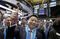 ZTO Express Founder, Chairman and CEO Meisong Lai, center, raises his ceremonial gavel on the New York Stock Exchange trading floor before his company's IPO, Thursday, Oct. 27, 2016. (AP Photo/Richard Drew)