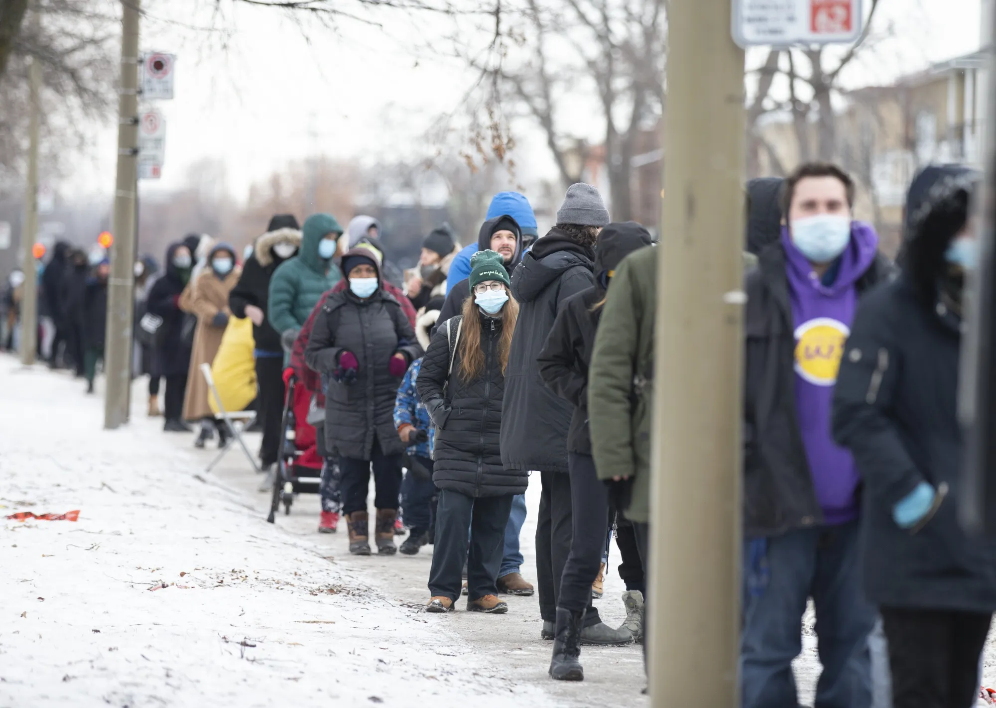 Residents wait in line outside a Covid-19 testing center in Montreal, Quebec, Canada, on&nbsp;Dec. 22.