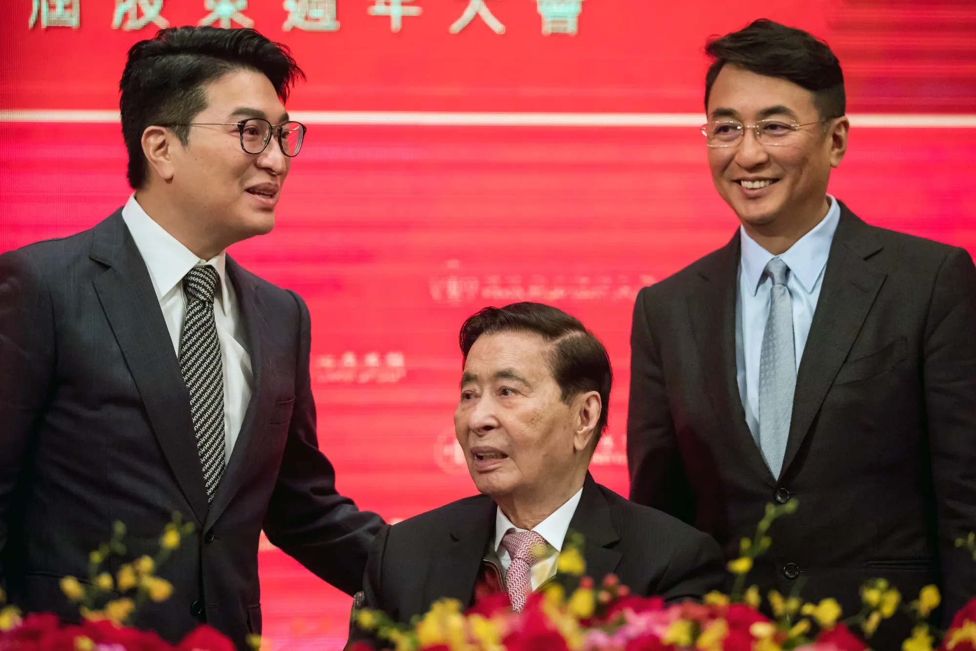 Lee Shau Kee, center, with his sons Martin Lee Ka Shing, left, and Peter Lee Ka Kit in 2019.