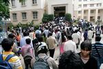 Indian students crowd outside a Common Admission Test (CAT) examination center in Bangalore