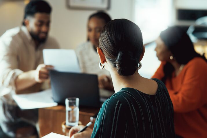 Group of Business People Collaborating Around Table