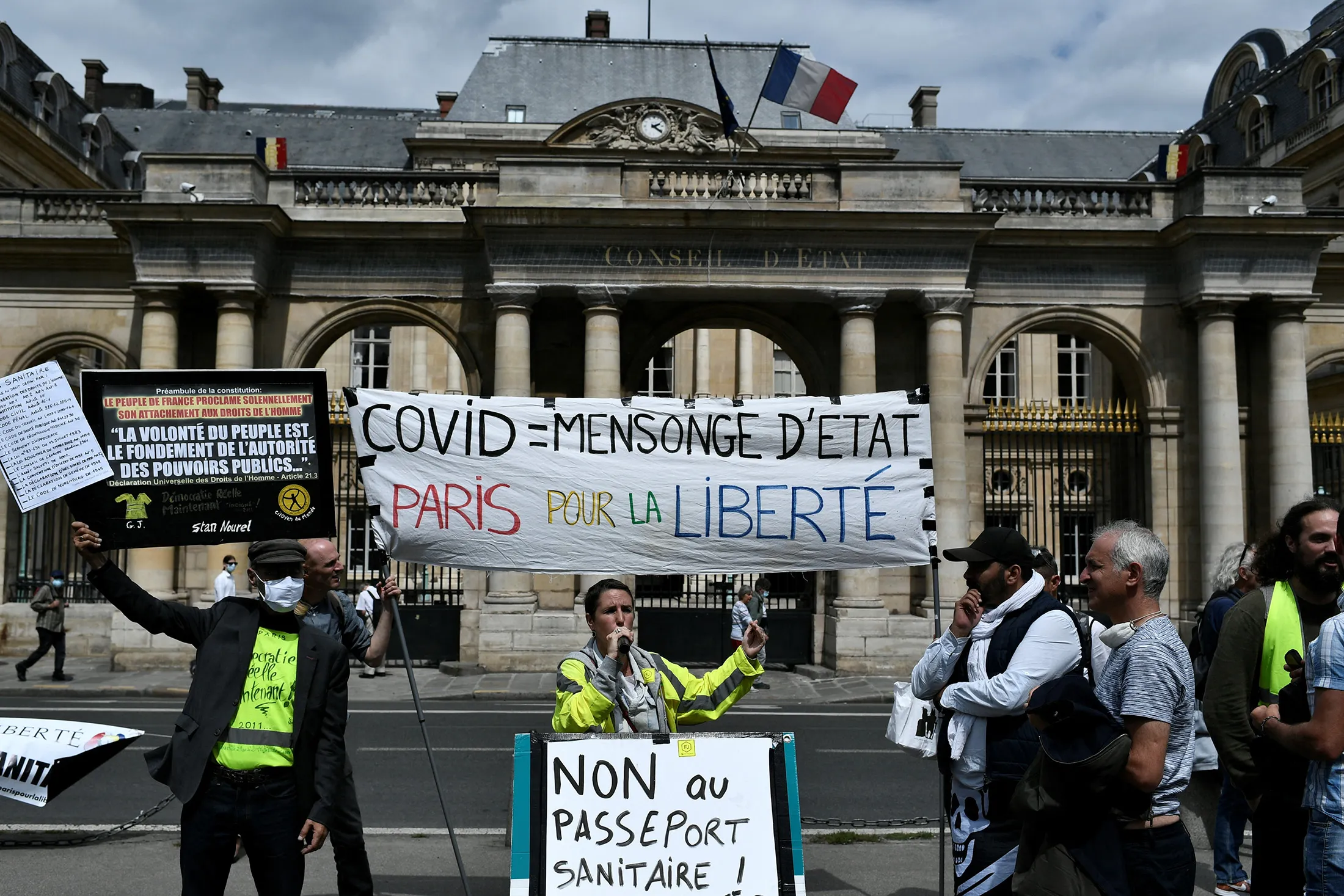 Demonstrators protest against the compulsory Covid-19 health pass&nbsp;outside the Constitutional Court&nbsp;in Paris on Aug.&nbsp;5.