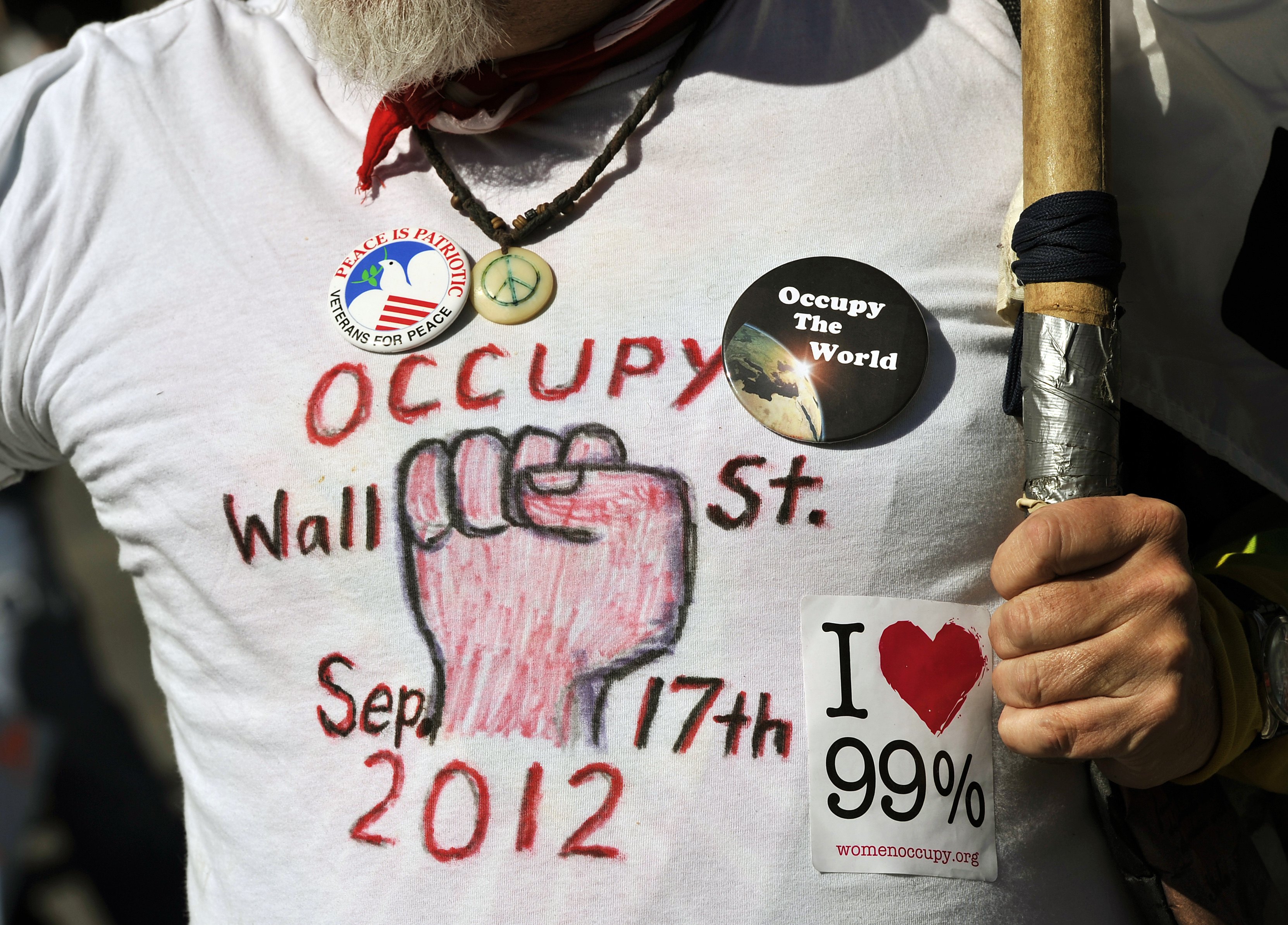 People gather in Washington Square Park in New York on September 15, 2012 during an Occupy Wall Street (OWS) One Year Anniversary Convergence Weekend. The special all-day Occupy Town Square with OWS tables, performances, and teach-ins. OWS is the name given to a protest movement that began on September 17, 2011 in Zuccotti Park.