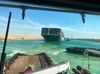 In this photo released by Suez Canal Authority, the Ever Given, a Panama-flagged cargo ship is accompanied by Suez Canal tugboats as it moves in the Suez Canal, Egypt, Monday, March 29, 2021. Salvage teams on Monday set free a colossal container ship that has halted global trade through the Suez Canal, bringing an end to a crisis that for nearly a week had clogged one of the world’s most vital maritime arteries. (Suez Canal Authority via AP) SUEZ CANAL AUTHORITY