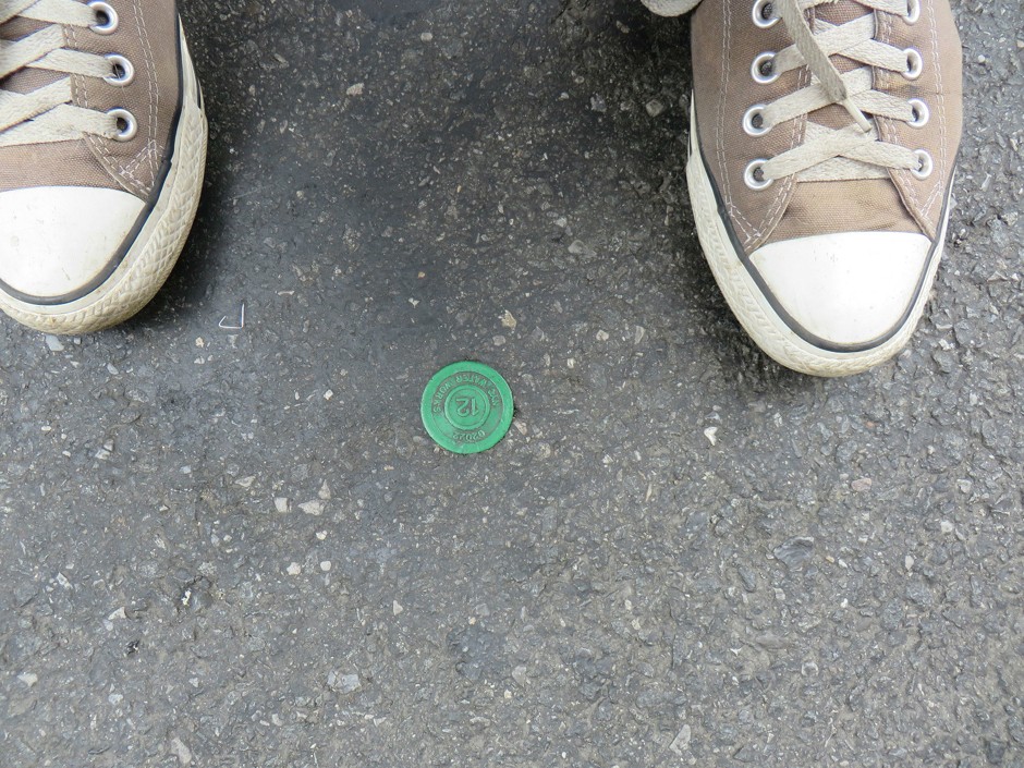 An a-tag placed in the asphalt of a New York street. But what does it mean?