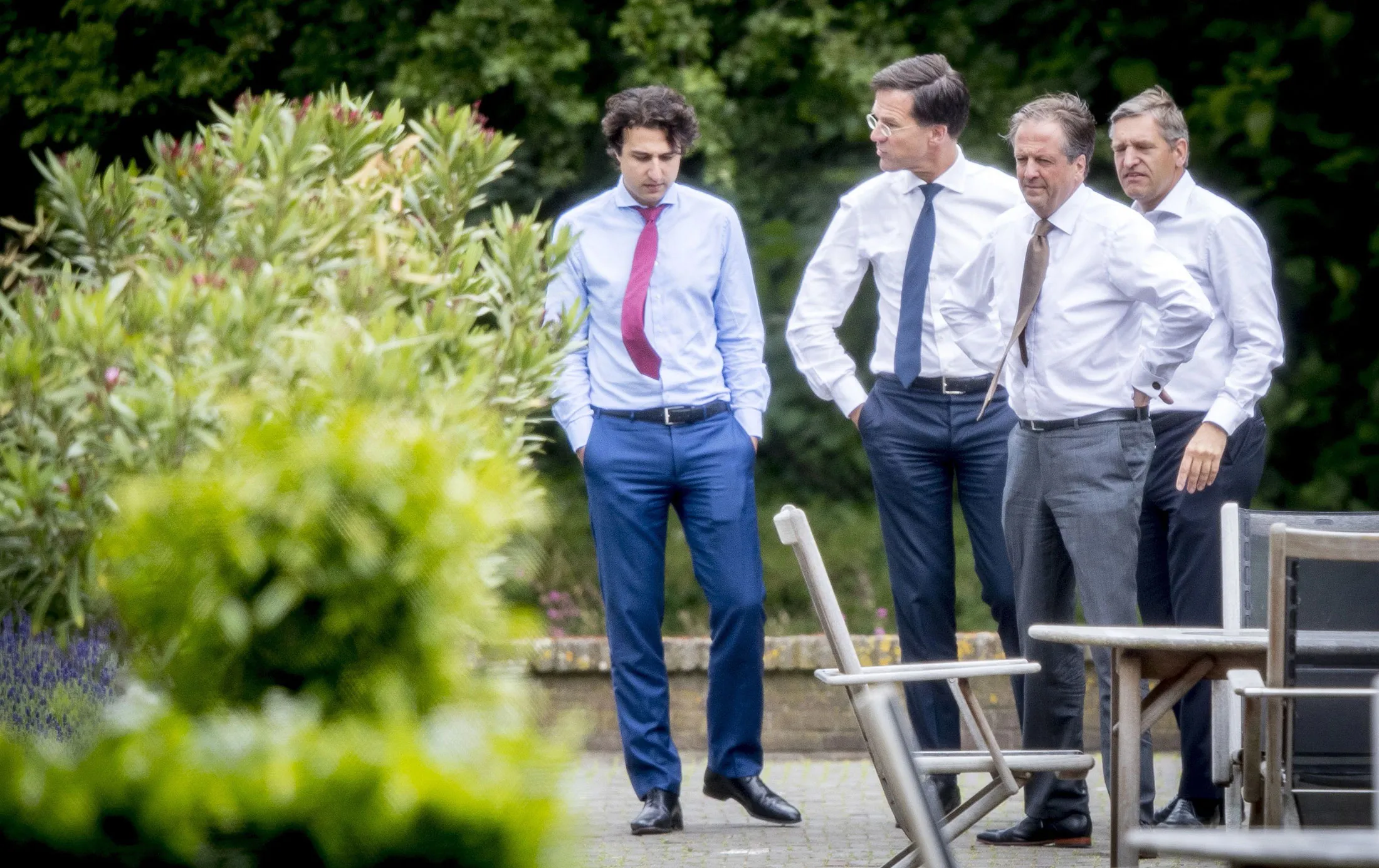 From left, Jesse Klaver of the Green Left Party (GroenLinks), Dutch Prime Minister Mark Rutte, Alexander Pechtold of Democrats 66 (D66) and Sybrand Buma of the Dutch Christian Democratic Appeal (CDA) talk in the garden of the Catshuis in The Hague, on June 12, during a meeting with informer Herman Tjeenk Willink.
