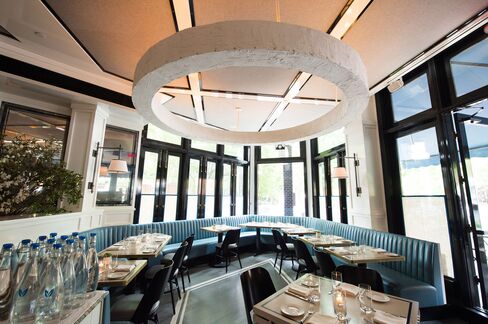 The dining room is bright and simply decorated, with plenty of outdoor seating on the sidewalk.