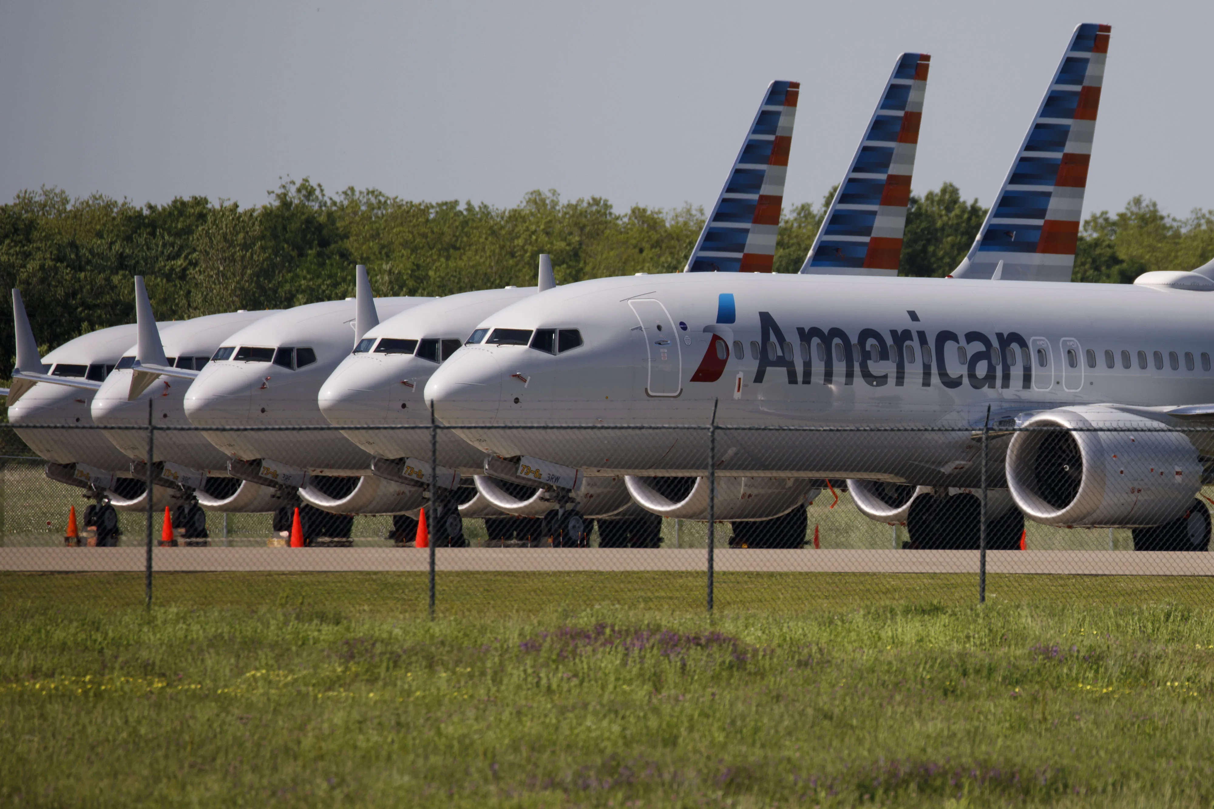 American Airlines Boeing Co. 737 Max planes sit parked outside of a maintenance hangar at Tulsa International Airport (TUL) in Tulsa, Oklahoma.