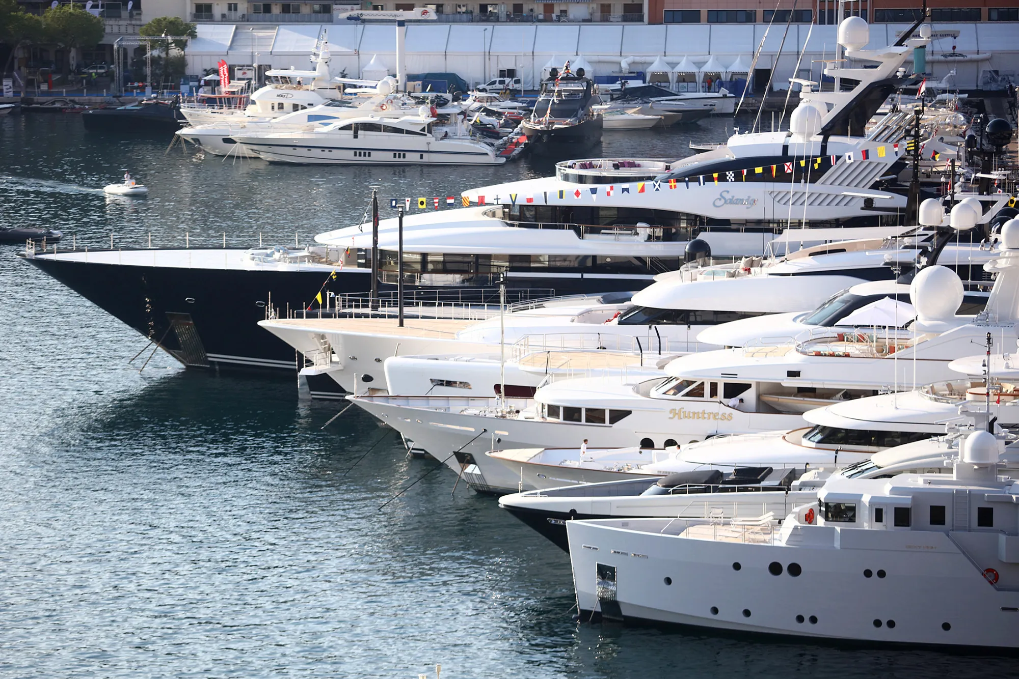 Luxury vessels sit moored in the harbor during the Monaco Yacht Show (MYS) in Port Hercules, Monaco, on Sept. 28, 2016.
