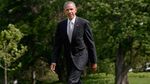 President Barack Obama walks across the South Lawn after returning to the White House from New Jersey on May 15, 2016, in Washington.