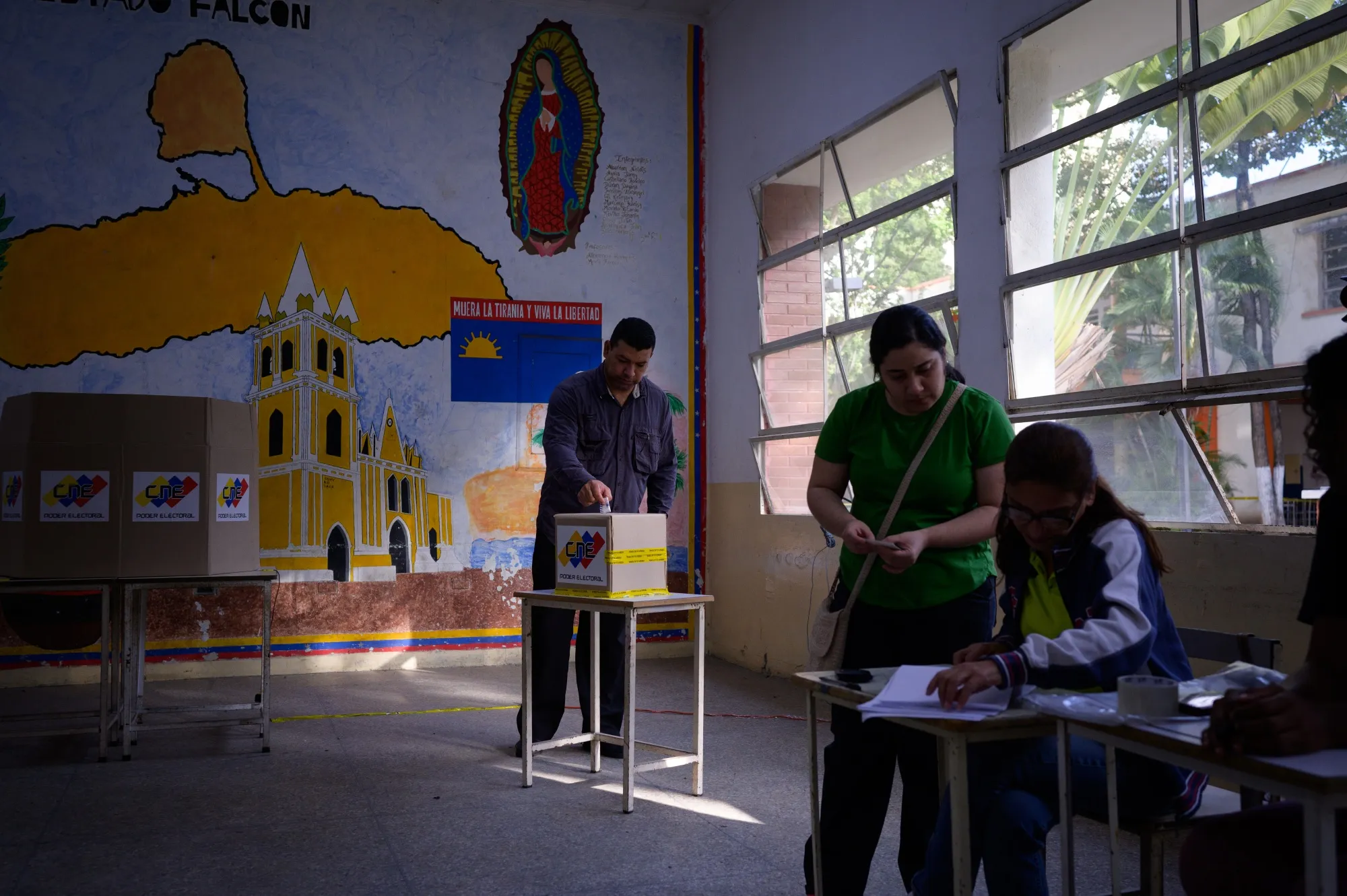 A voter casts a ballot at a polling station during the presidential election in Caracas on&nbsp;July 28.&nbsp;