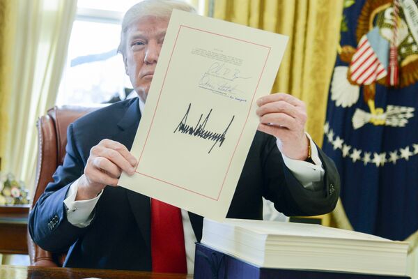 President Trump Signs The Tax Cuts And Jobs Act Into Law 
