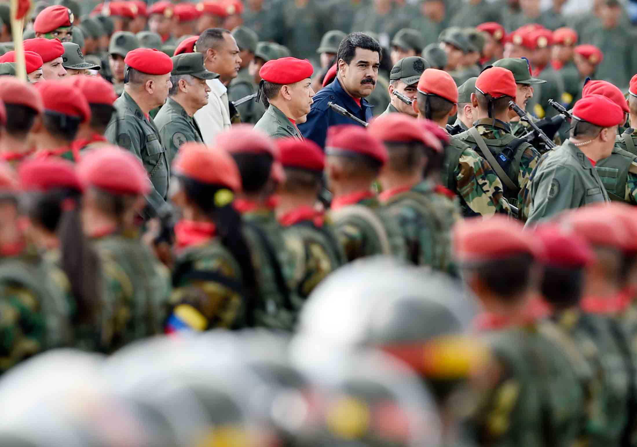 Venezuelan President Nicolas Maduro walks during a military parade in Caracas on Dec. 12, 2015.

