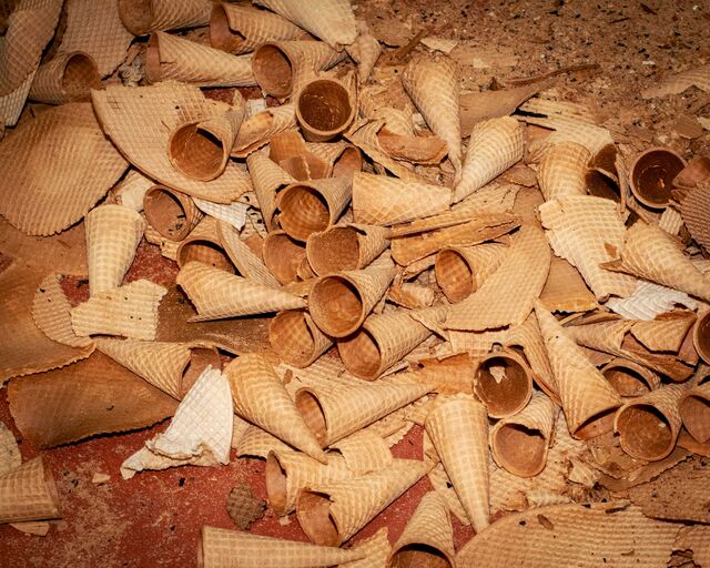 A pile of discarded waffle cones to be sold for use as animal feed.