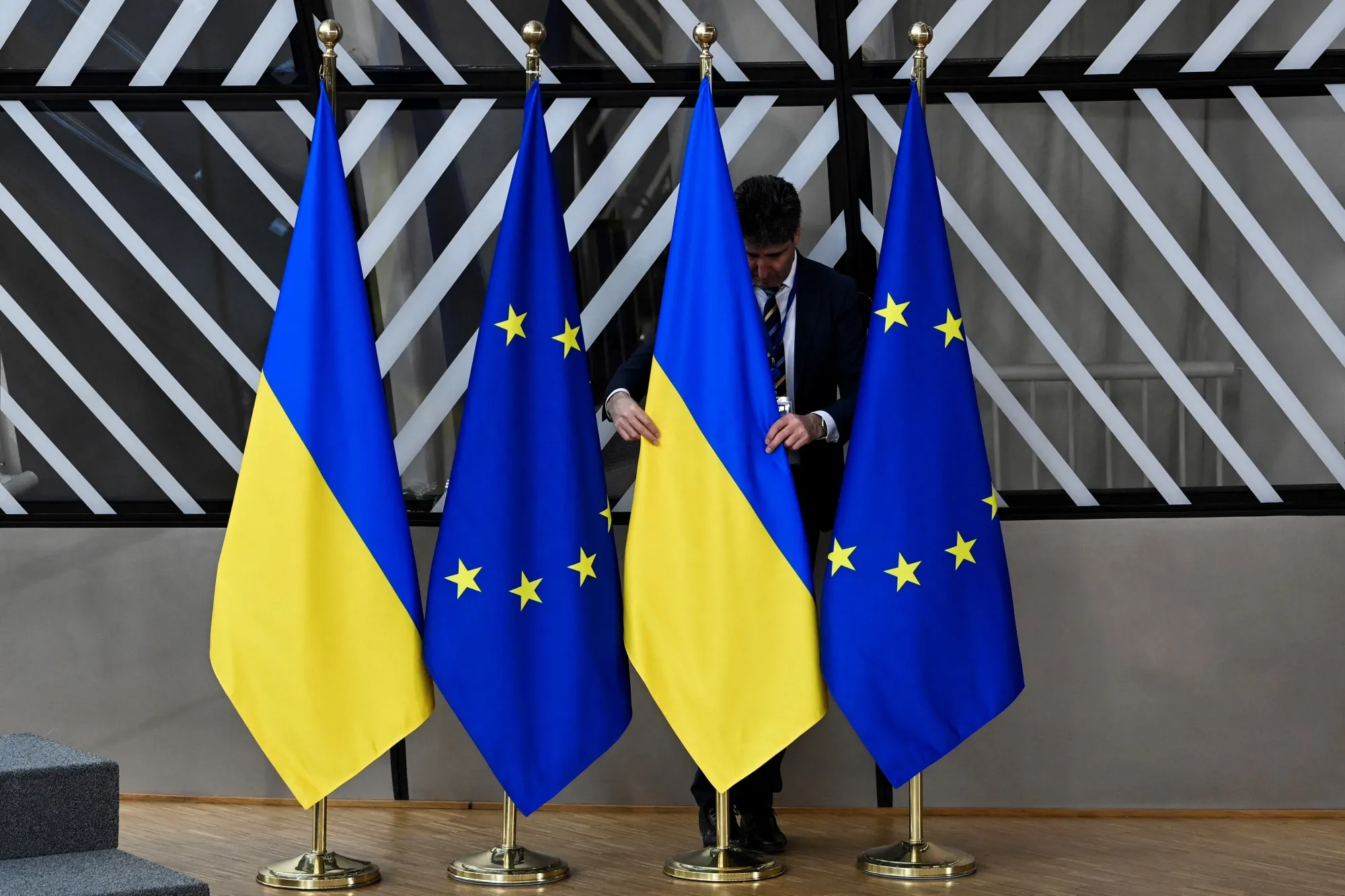 Ukrainian and EU flags at European parliament in Brussels.