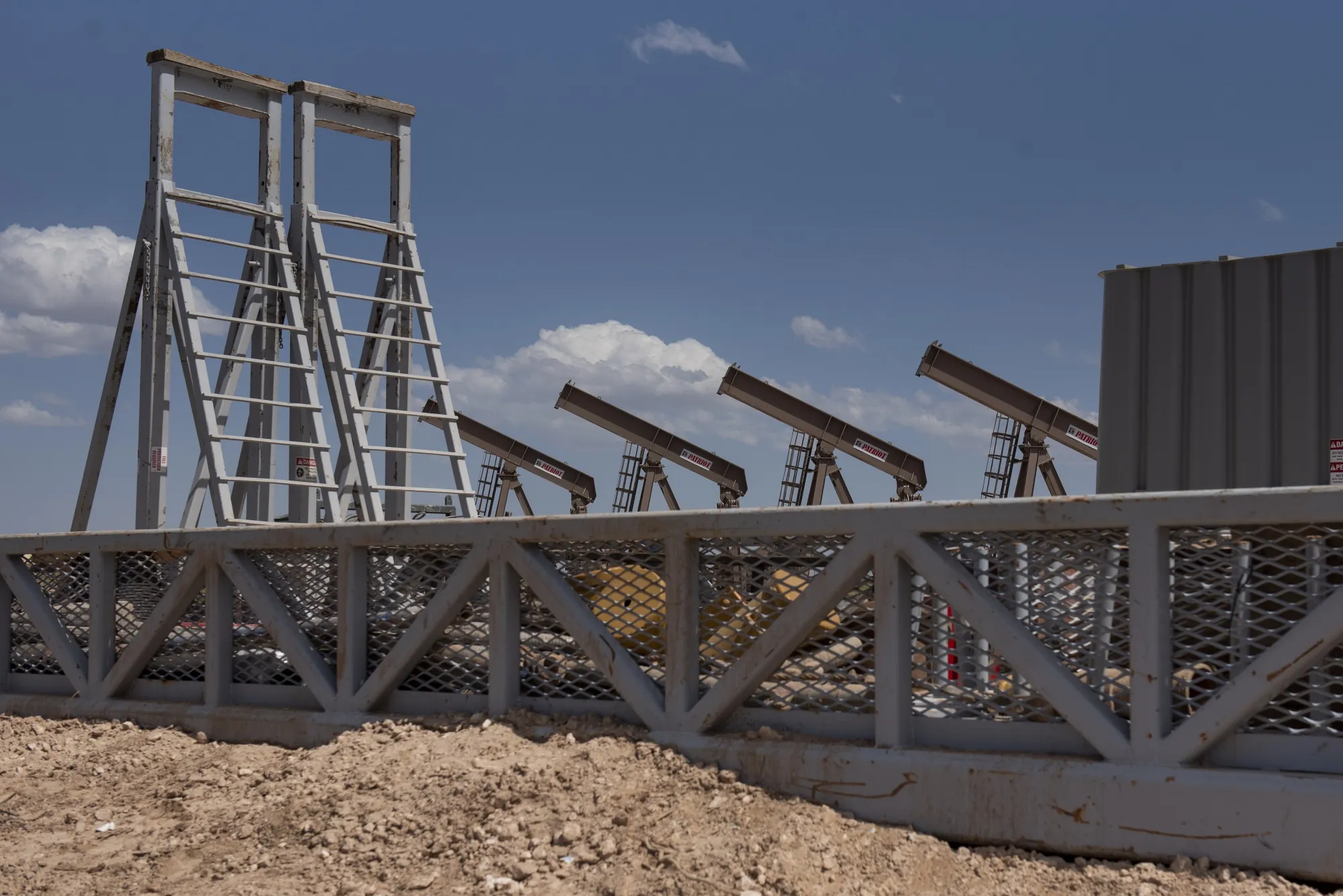 A row of pumpjacks at&nbsp;a Diamondback Energy Inc. oil rig in Midland, Texas.