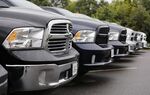 Dodge Ram pickup trucks lined up for sale.