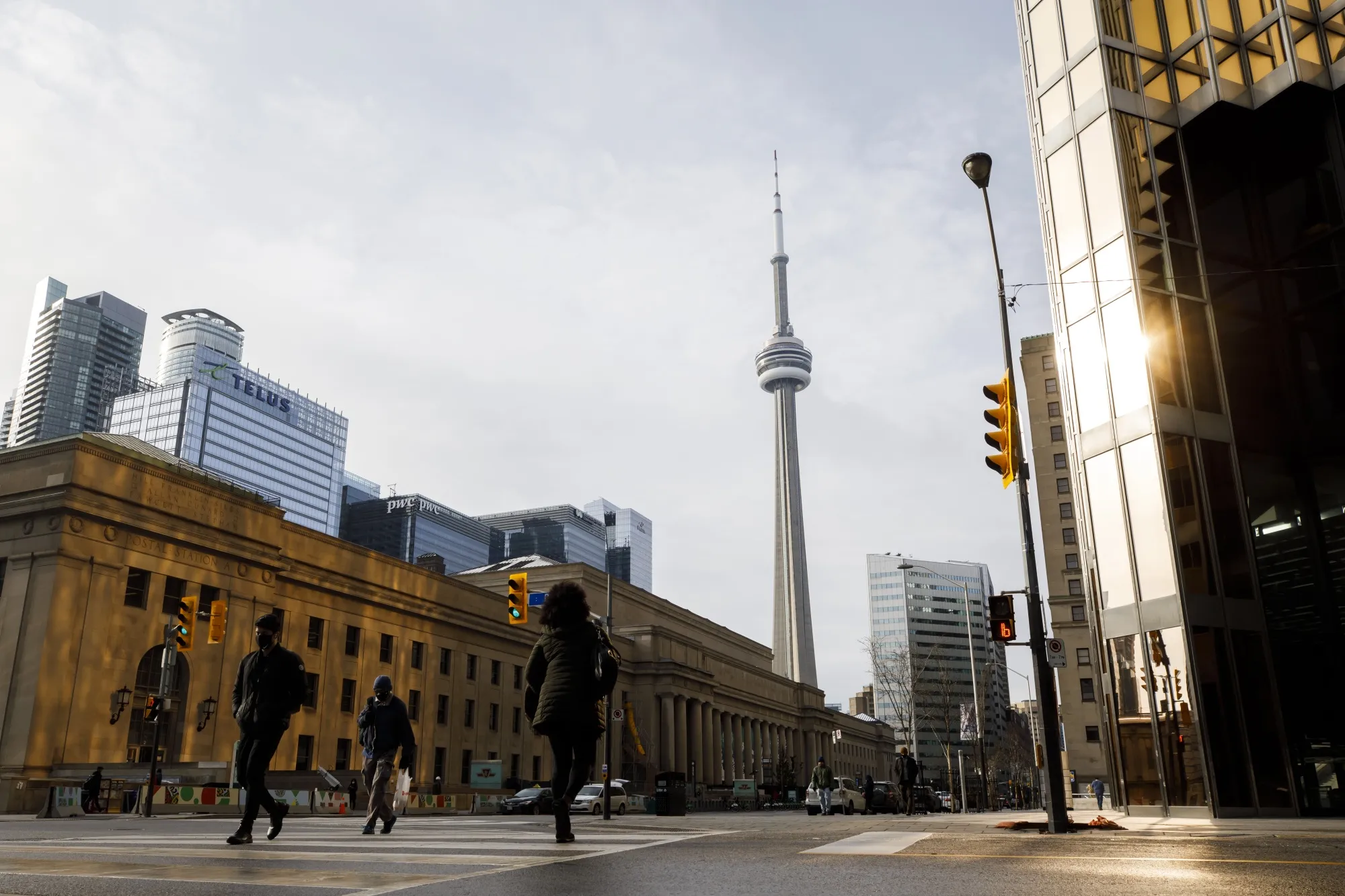 Pedestrians walk through downtown Toronto.