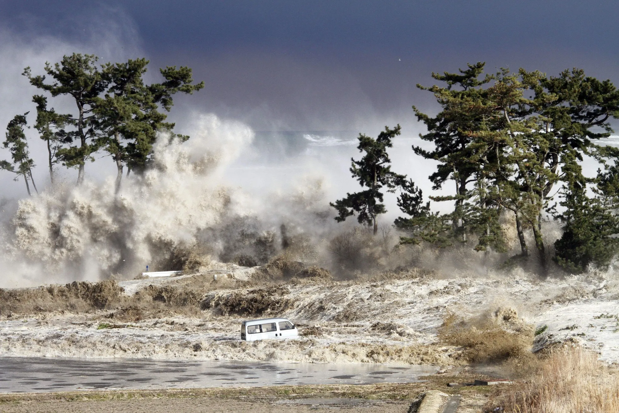Tsunami waves, caused by the Tohoku earthquake, hit the coast of Minamisoma in Fukushima prefecture in March 2011.