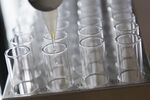 An automated machine works on purification of potential hepatitis C virus drug candidate at the Gilead Sciences Inc. lab in Foster City, California, U.S.