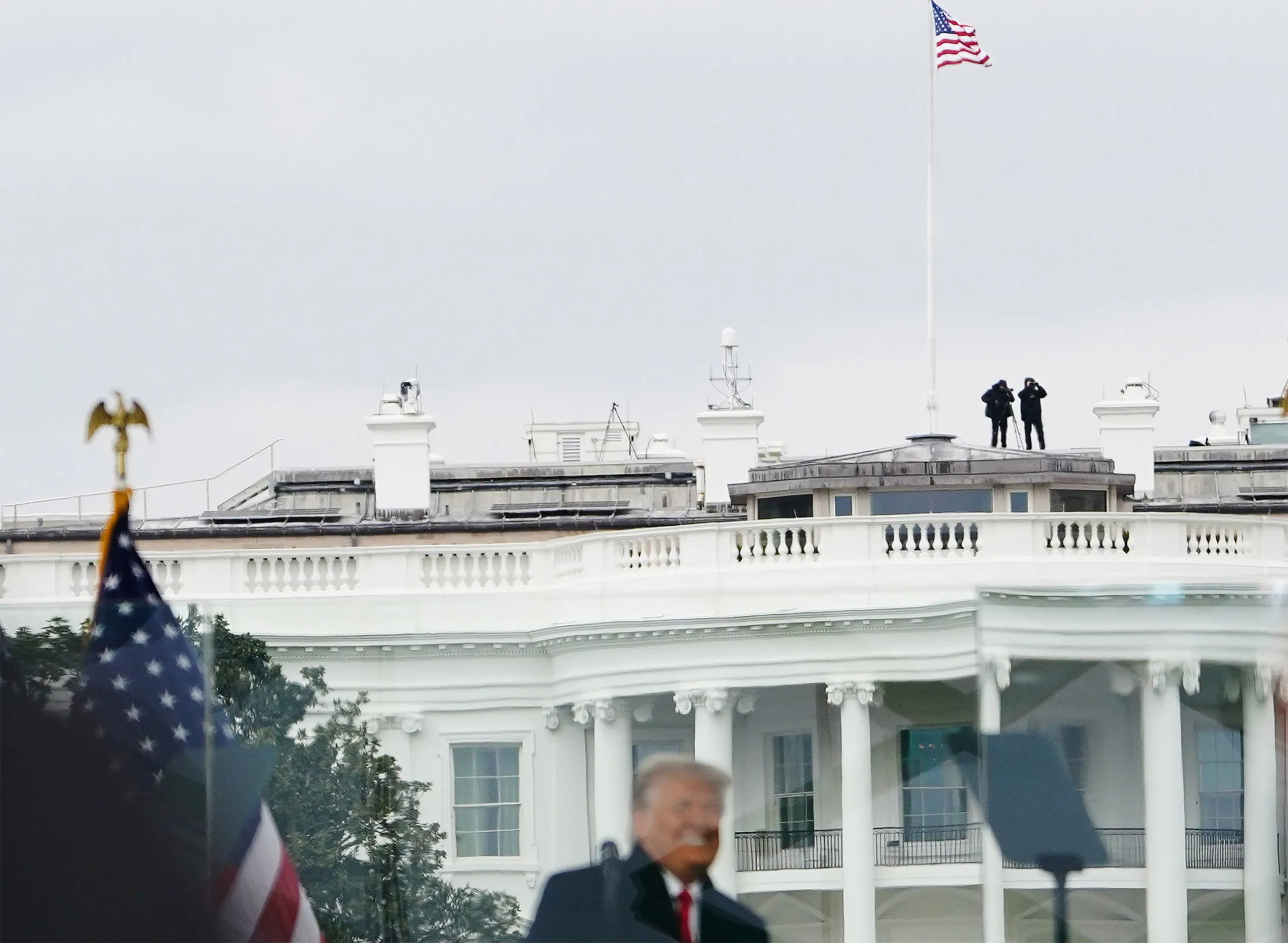 Members of the Secret Service patrol from the roof of the White House as then-President Donald Trump speaks to supporters from the&nbsp;Ellipse on Jan. 6, 2021.