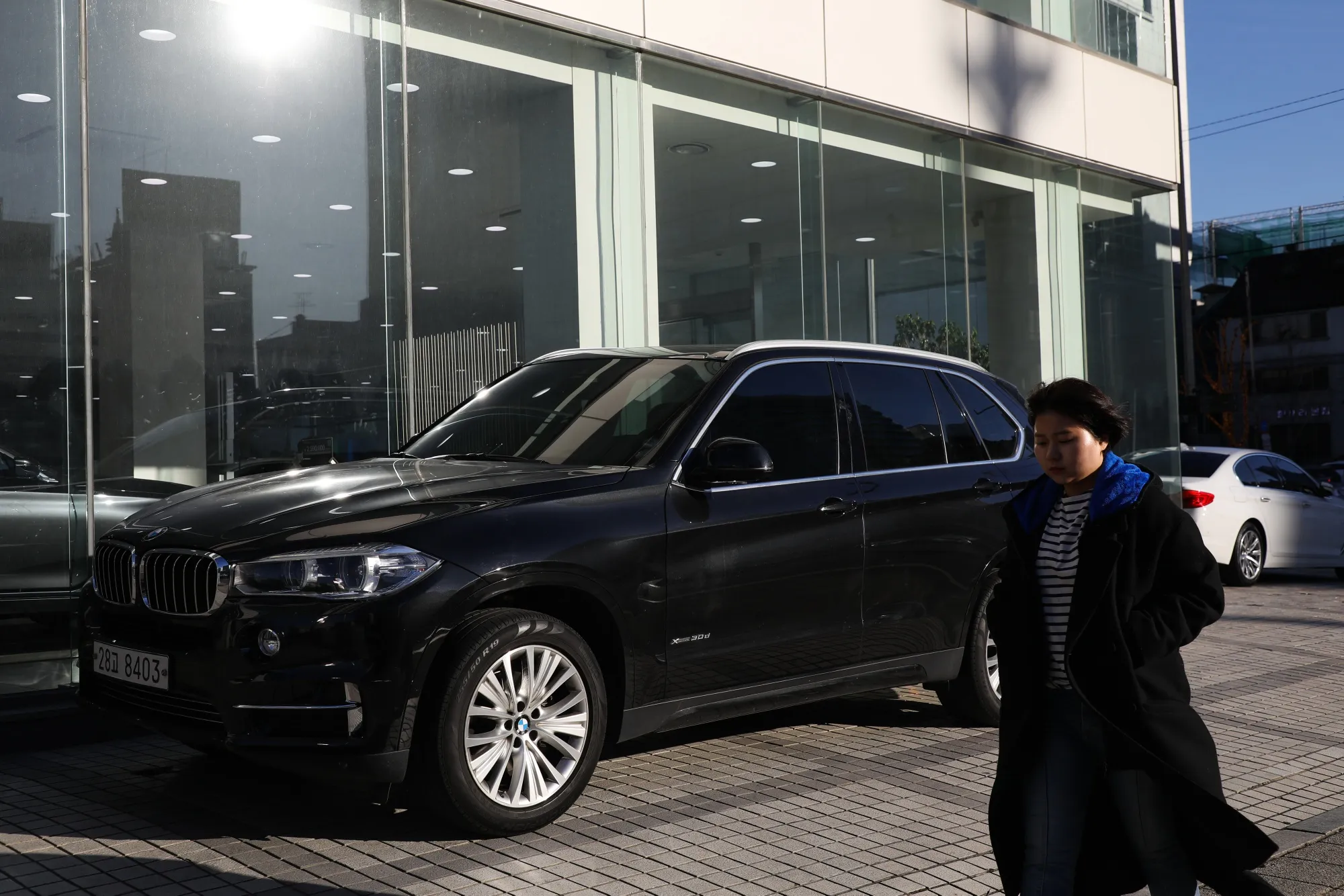 A BMW AG sport utility vehicle (SUV) parked outside a dealership in Seoul.