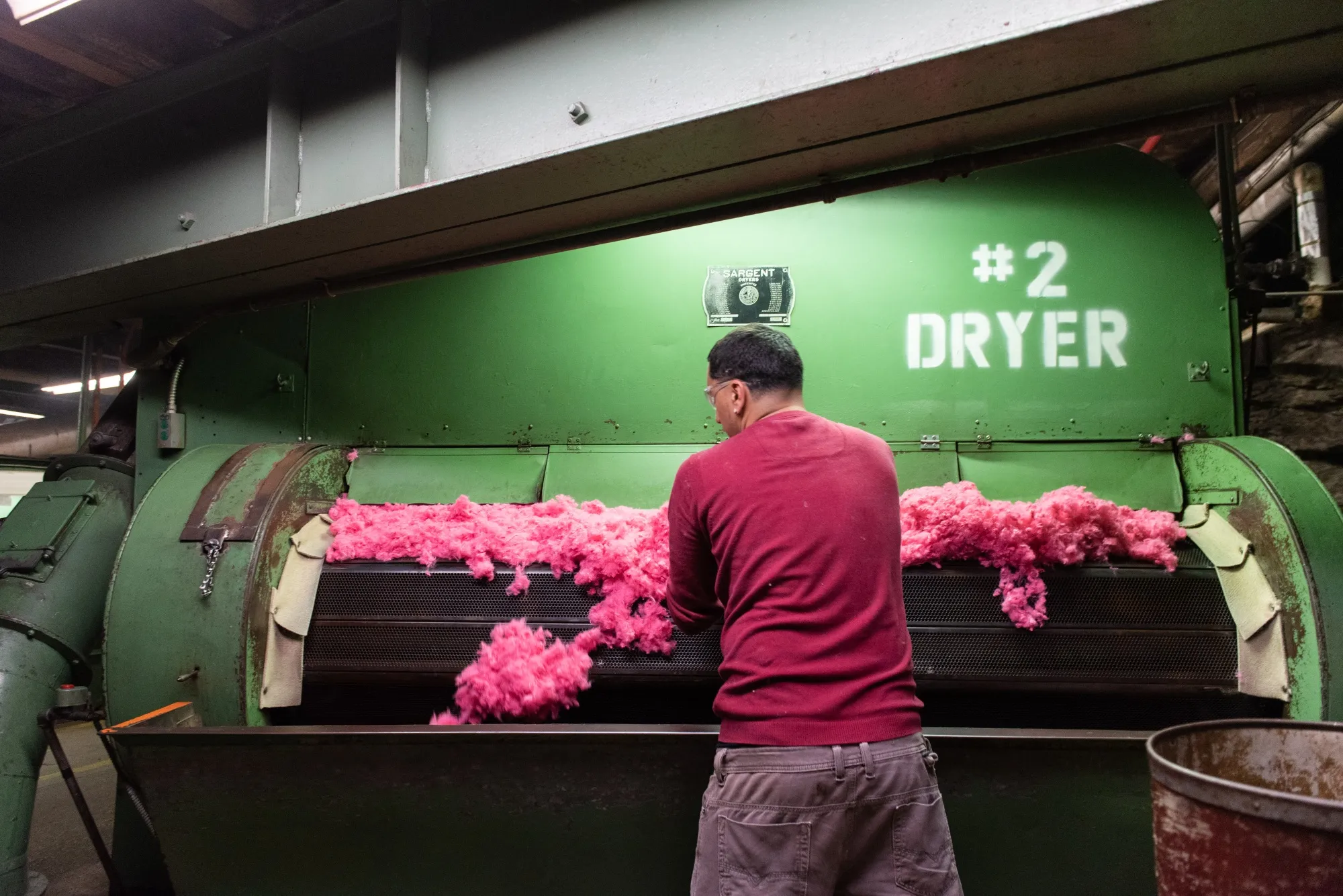 A worker checks dried&nbsp;fiber at the G.J. Littlewood &amp; Sons Inc. raw stock dye house in Philadelphia, Pennsylvania.