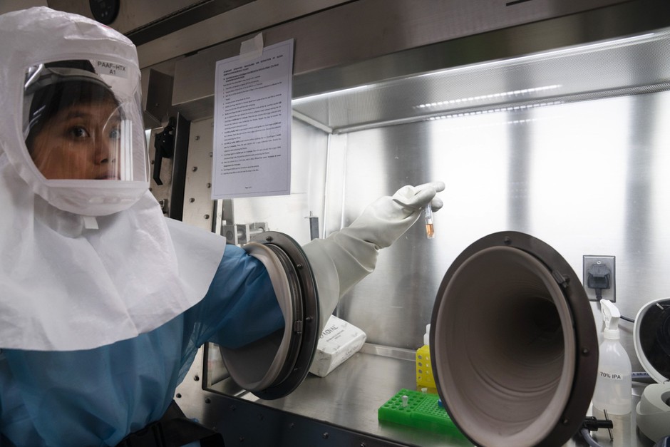 A lab technician in Singapore, where city authorities moved quickly to test for the novel coronavirus.