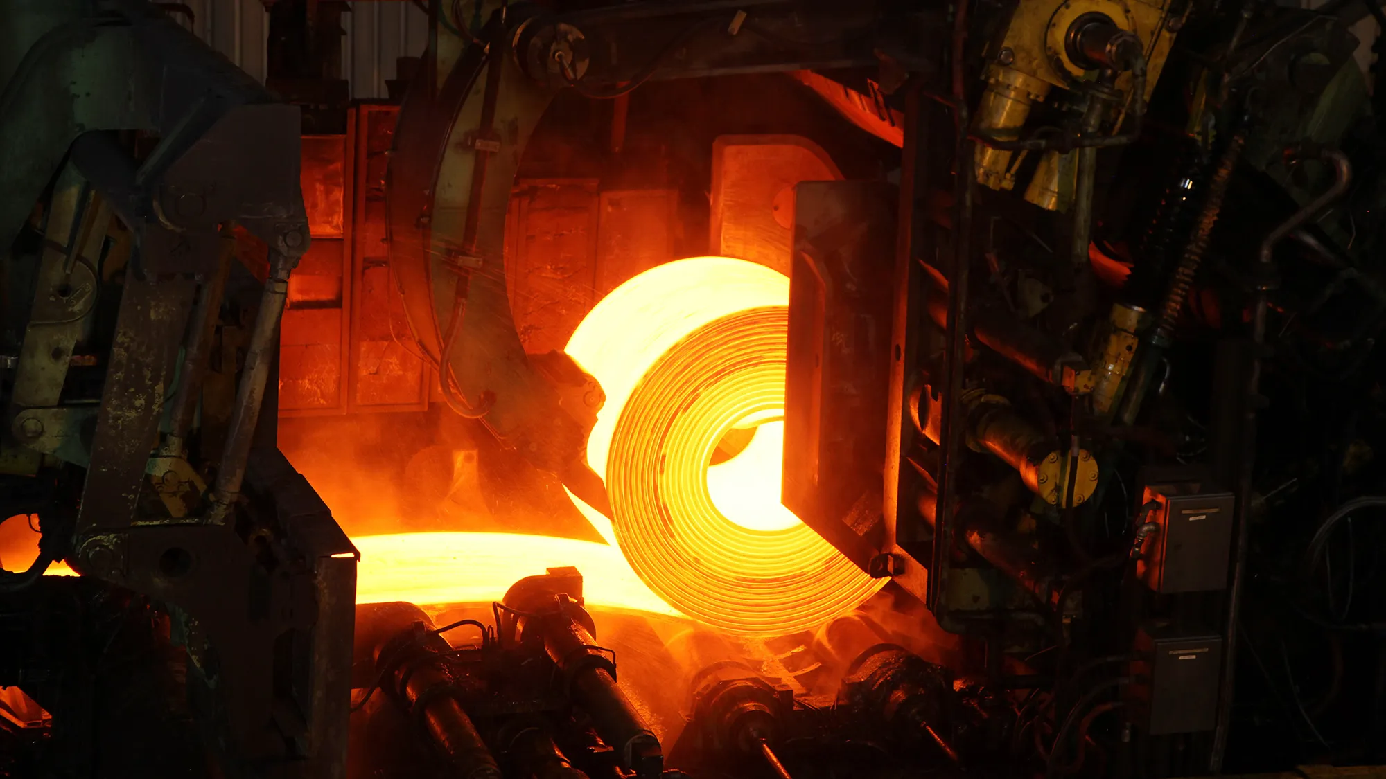 Red-hot rolled steel coil at a steel mill in Espirito Santo, Brazil.