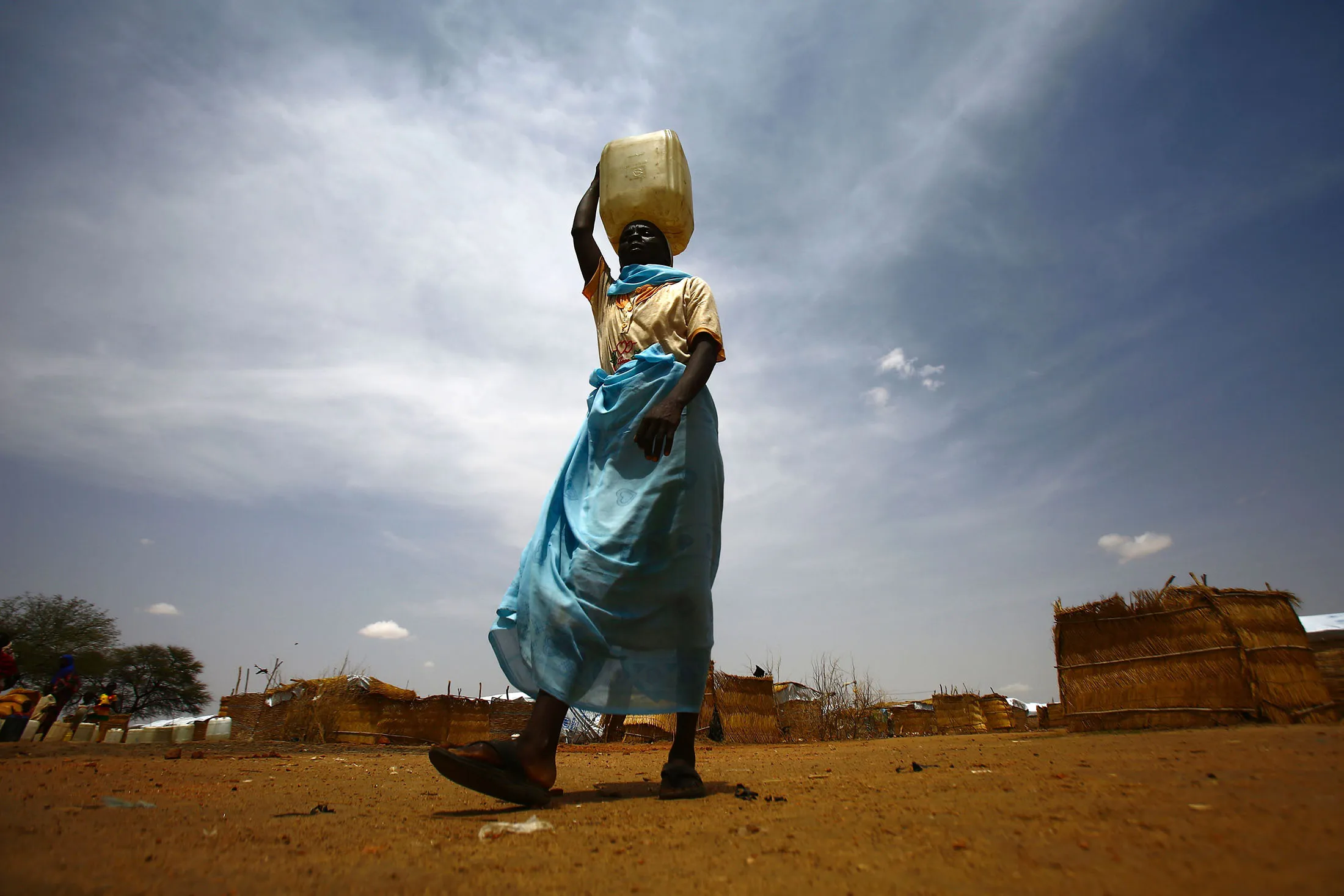 TOPSHOT - A South Sudanese woman walks at Al-Nimir refugee camp in Sudan's east Dafur on June 20, 2017. South Sudan, which split from the north in 2011, has declared famine in parts of the country, saying a million people are on the brink of starvation. / AFP PHOTO / ASHRAF SHAZLY (Photo credit should read ASHRAF SHAZLY/AFP/Getty Images)

