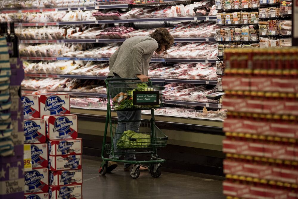 A customer shops for meat at a store in Oakland, California.