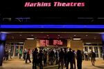 Movie-goers wait in line to buy tickets at a Harkins movie theater in Denver, Colorado.