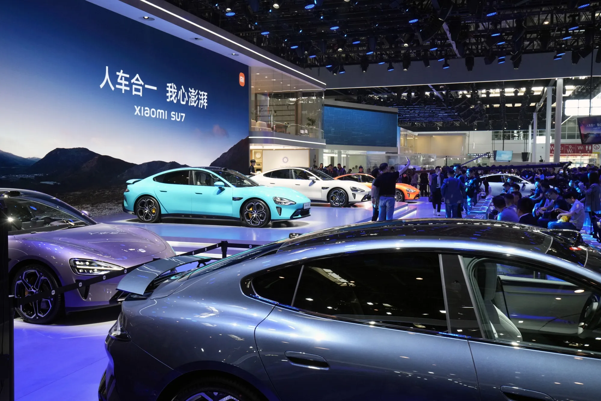 Xiaomi Corp. SU7 electric vehicles during the Beijing auto show on April 25, 2024.