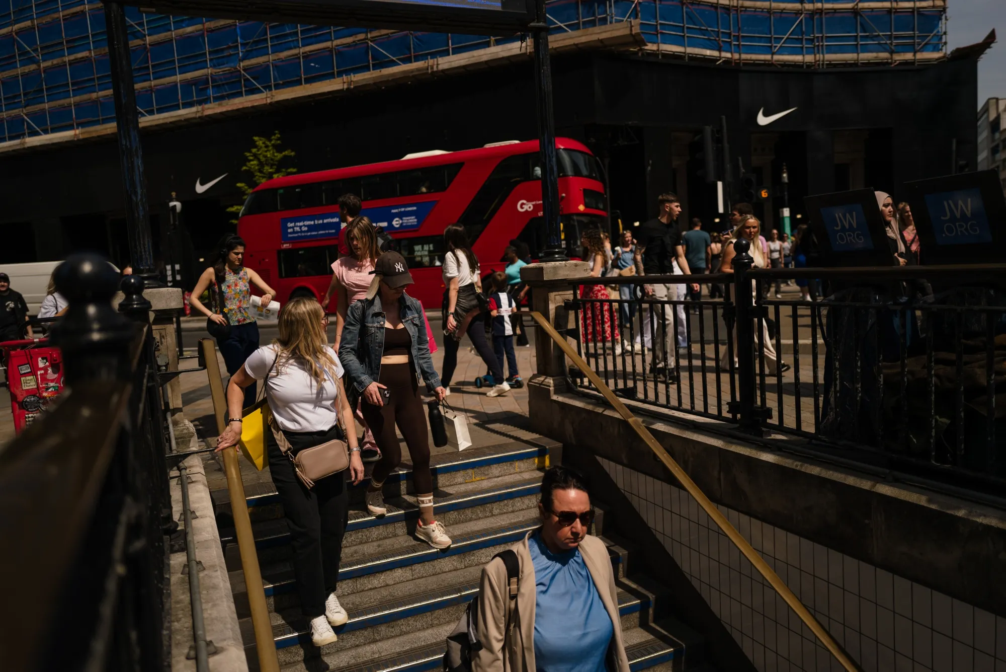 Shoppers enter the Oxford Circus London Underground station in central London, UK.