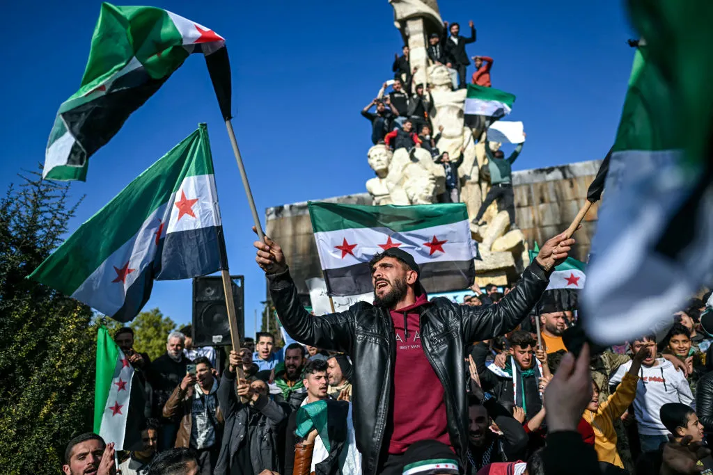 People gather at Saadallah al-Jabiri Square after the Friday noon prayer in Aleppo on Dec. 13.