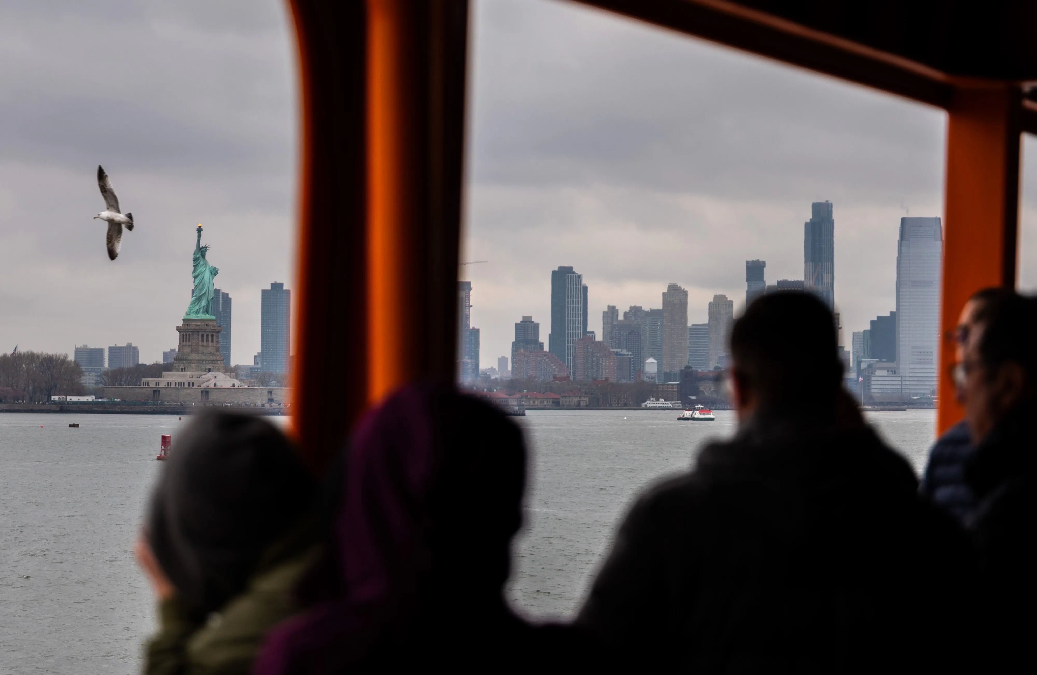 Tourists ride the Staten Island Ferry in New York City.&nbsp;