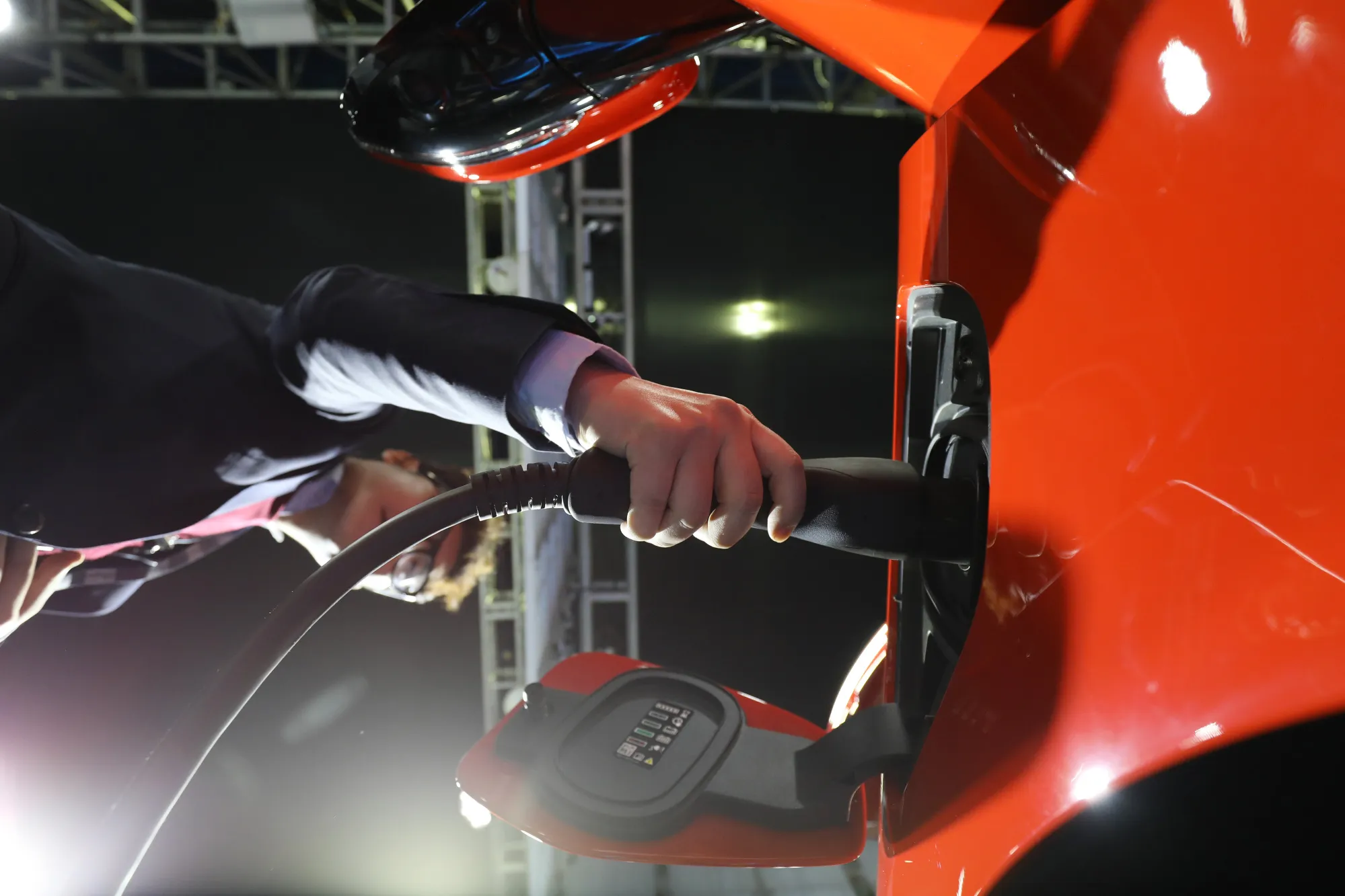An employee connects a charging cable to the Jaguar Land Rover Automotive Plc I-Pace electric vehicle (EV) at the EV Trend Korea exhibition in Seoul, South Korea, on April 12.