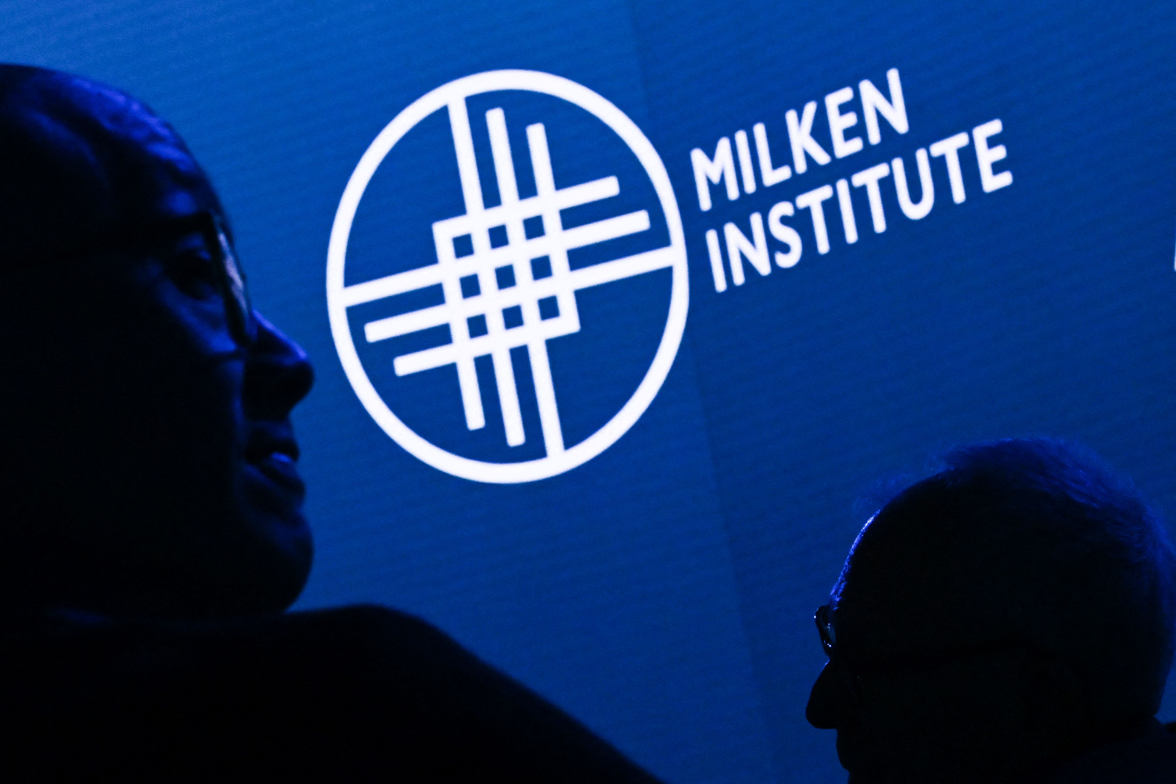 Attendees wait for a presentation during the Milken Institute Global Conference in Beverly Hills. Photographer: Patrick T. Fallon/AFP/Getty Images